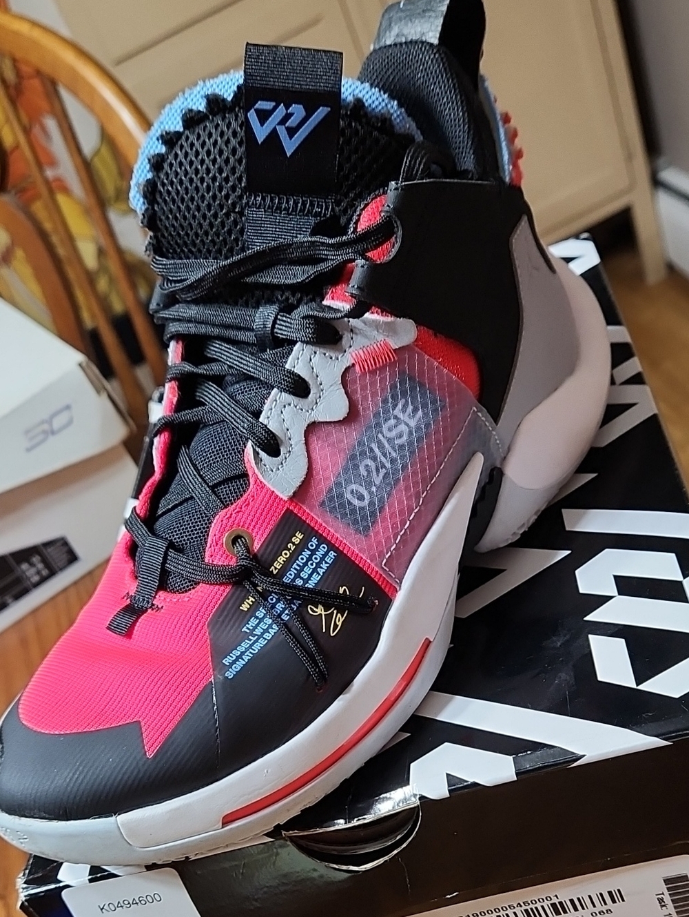 Boy's Jordans in Black, Red and Light Blue - Visible Logo on Tongue